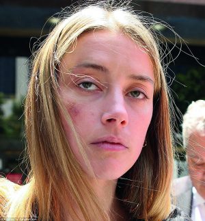 34b3cb2100000578-3613134-amber_heard_30_was_granted_a_temporary_restraining_order_against-a-82_1464379672384